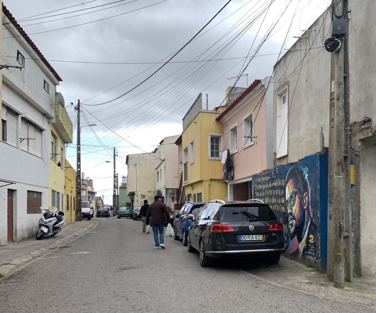 A mural of Malcolm X is painted along a street in Cova da Moura, one of Portugal's lower income neighborhoods.